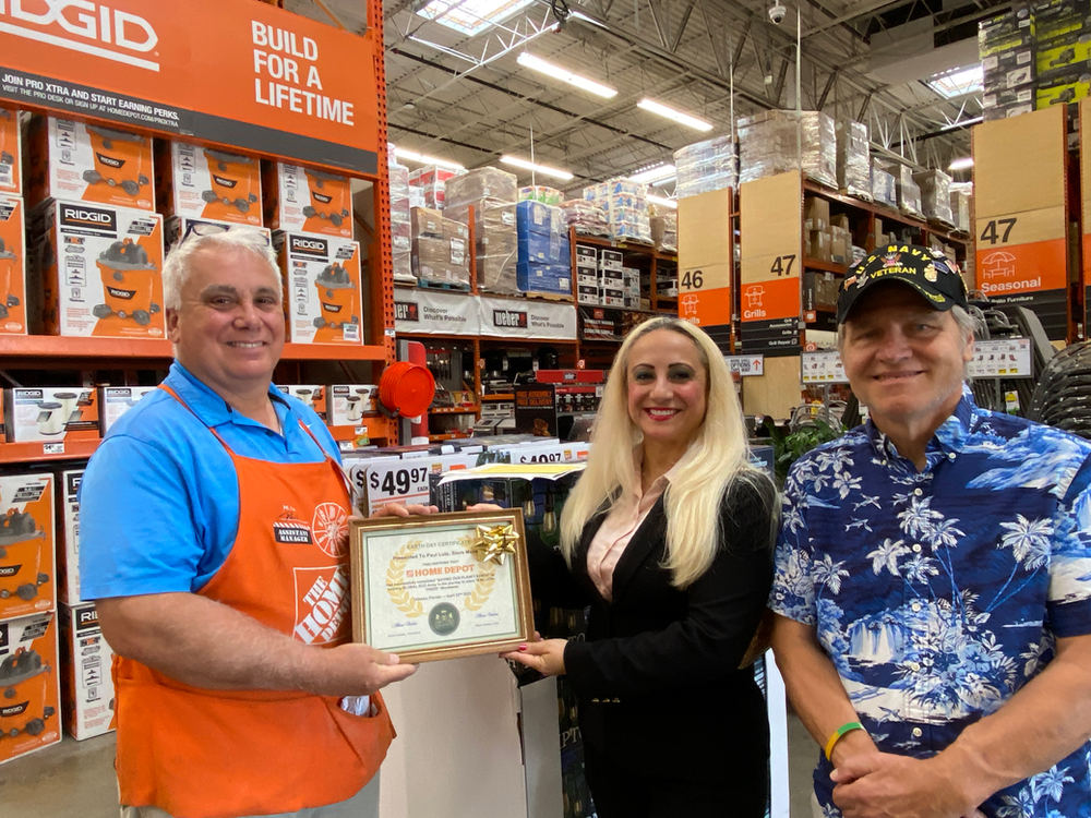 The Home Depot receiving a Plaque of Honor from Global Eco Army